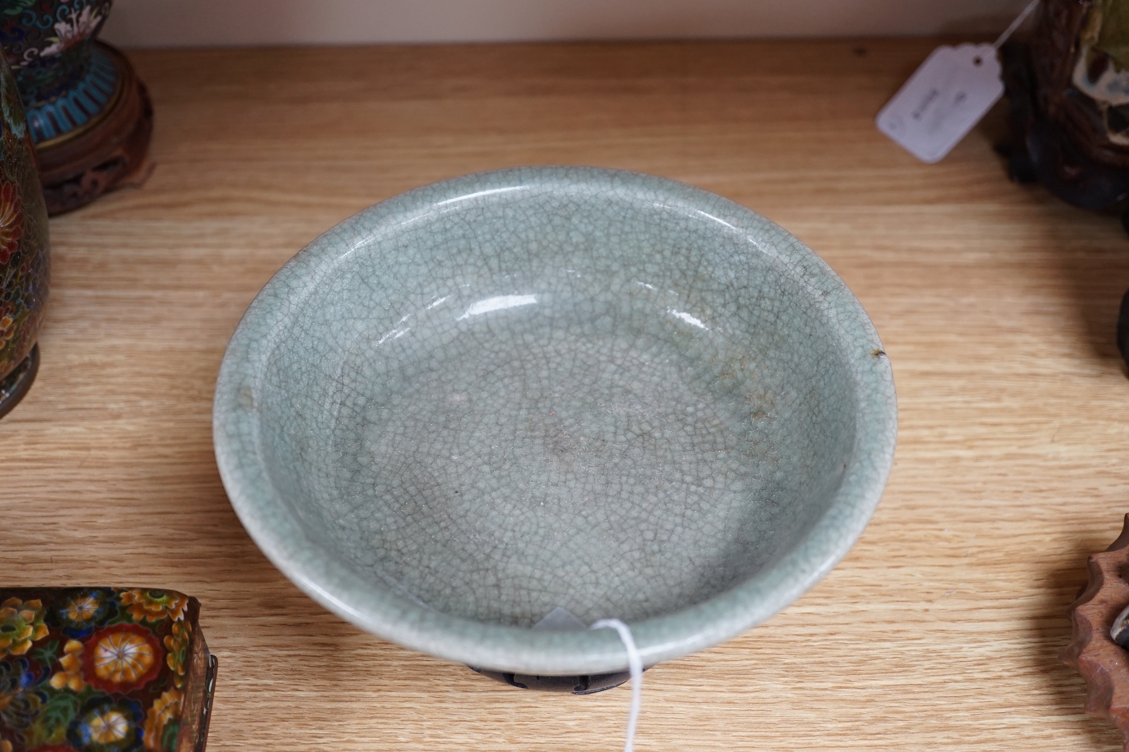 A Chinese Guan type green crackle glaze bowl, early 20th century 19cm diameter, on hardwood stand